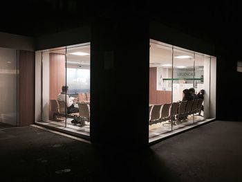 People sitting in waiting area of hospital