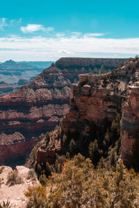 Rock formations on landscape against sky