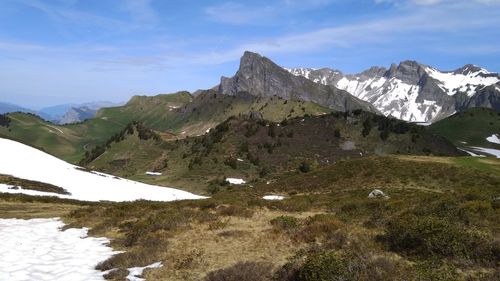 Scenic view of mountains against sky during winter