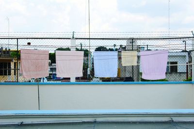 View of built clothing's line against the sky