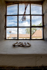 Low angle view of window on old building