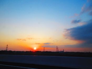 Silhouette landscape against sky during sunset