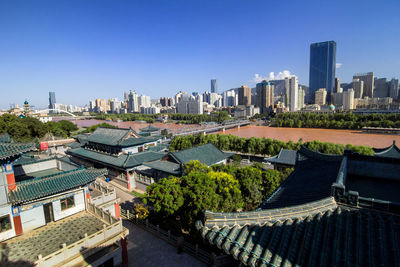 Panoramic view of buildings against sky in city