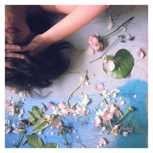 Close-up of woman holding flowers