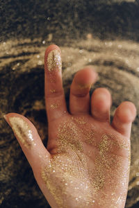 Close-up of hand with glitter