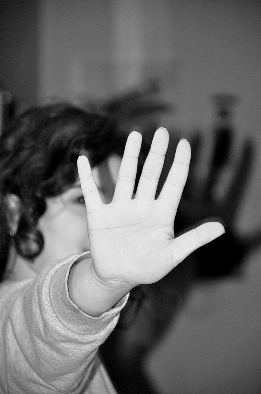 CLOSE-UP OF WOMAN WITH HAND