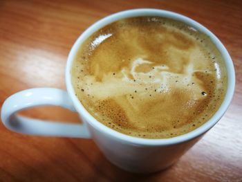 High angle view of cappuccino on table