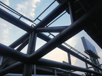 Low angle view of metal structure against sky