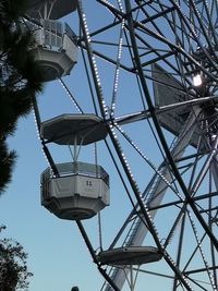 Low angle view of ferris wheel against sky