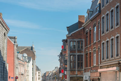 Low angle view of buildings in city against sky