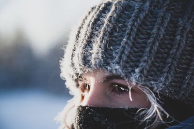 Close-up portrait of woman wearing hat during winter