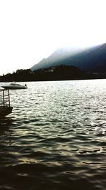 Scenic view of lake with mountains in background