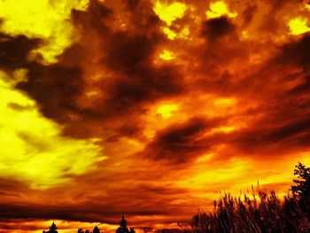 Low angle view of cloudy sky at sunset