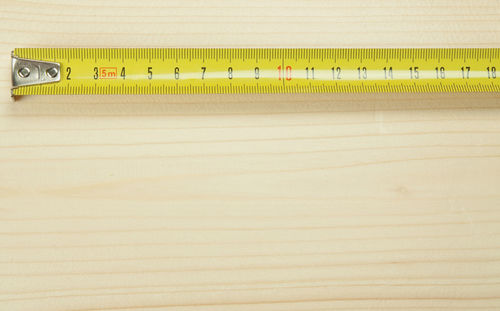 Close-up of measuring tape on table