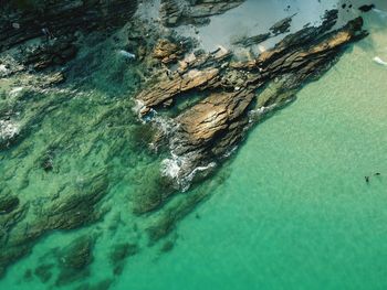 High angle view of rock formation in sea