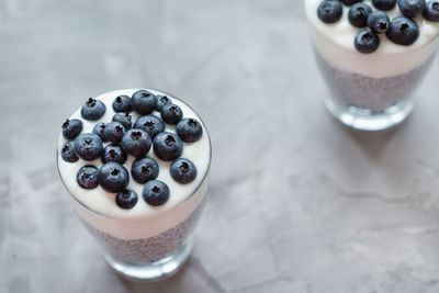Chia pudding with almond milk, yogurt and blueberries dessert. vegan concept