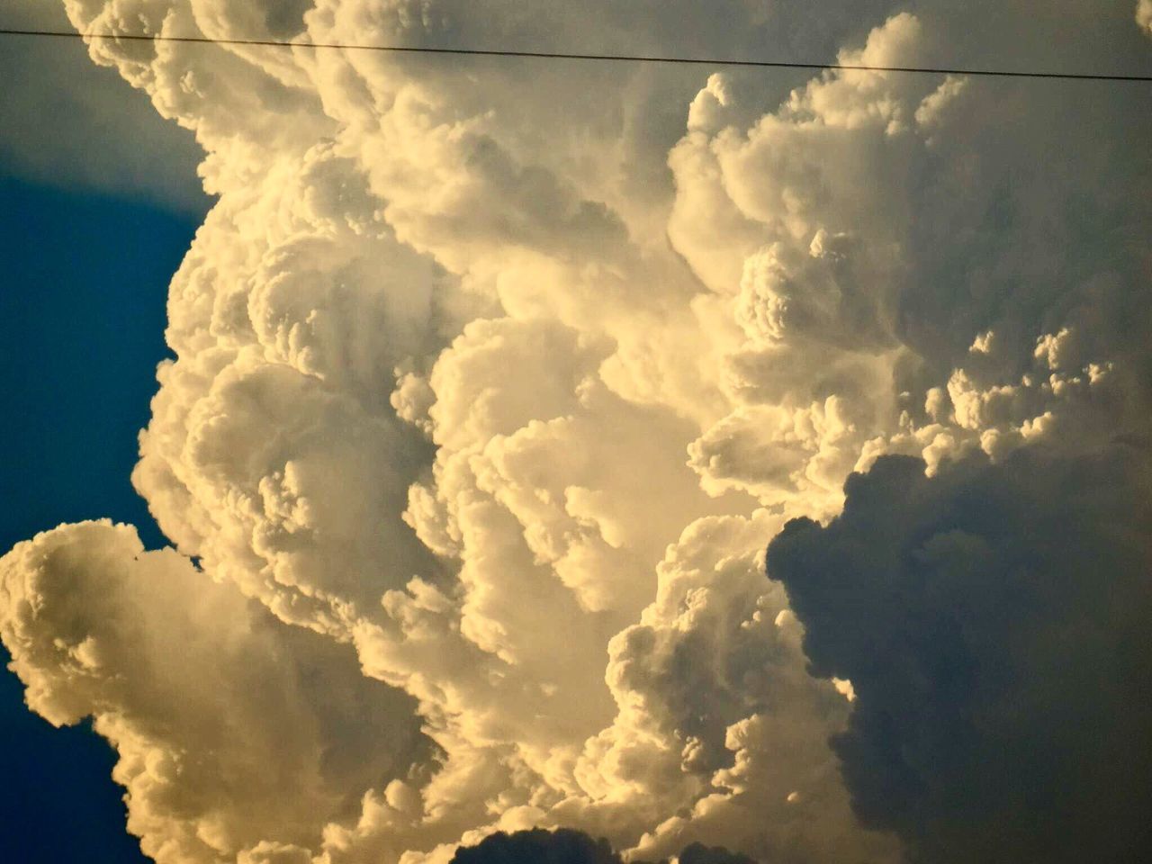 sky, cloud - sky, low angle view, cloudy, beauty in nature, scenics, tranquility, nature, cloud, cloudscape, sky only, tranquil scene, backgrounds, weather, idyllic, outdoors, no people, full frame, blue, overcast, dramatic sky, majestic, day, white, dark