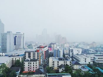 Buildings in city against sky