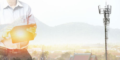 View of a man holding glass of mountain