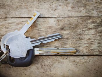 High angle view of keys on wooden table