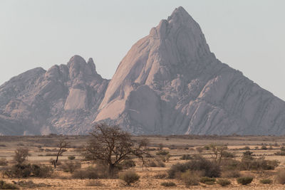 Scenic view of arid landscape against clear sky