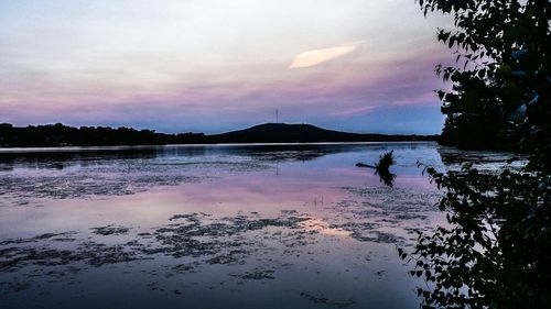 Scenic view of lake at sunset