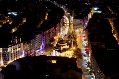 High angle view of city buildings at night