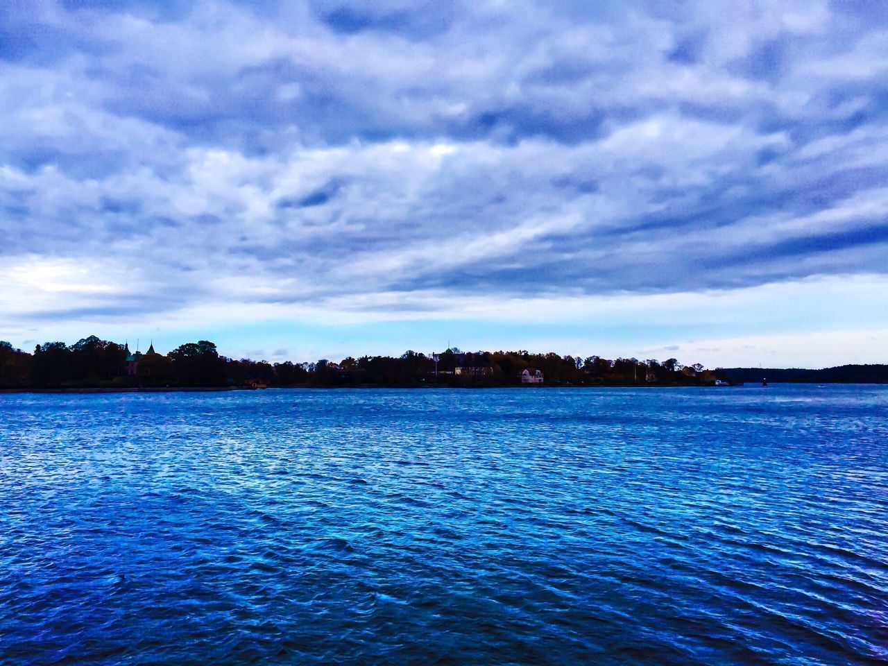 water, sky, waterfront, tranquil scene, scenics, tranquility, cloud - sky, beauty in nature, rippled, cloud, sea, cloudy, nature, blue, lake, idyllic, calm, reflection, outdoors, no people