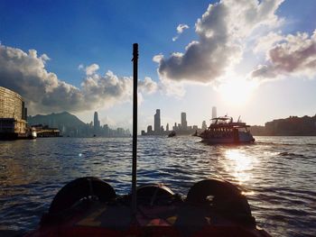 Panoramic view of sea and buildings against sky