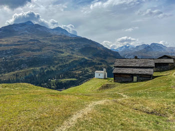 Scenic view of landscape and mountains against sky