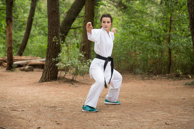 Full length of woman exercising in park