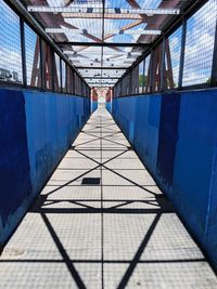 Low angle view of empty footbridge