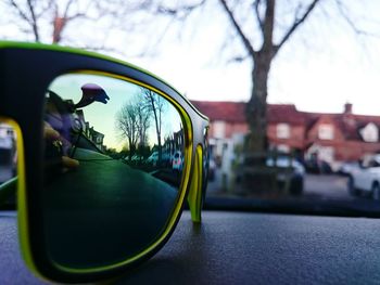 Close-up of car on street against sky