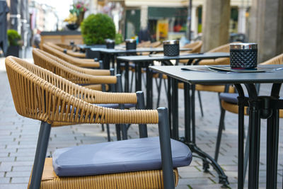 Empty chairs and tables in cafe