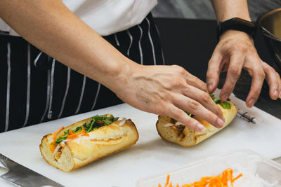 Midsection of man preparing food