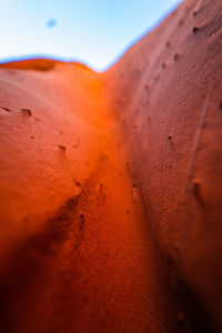 Close-up of sand against sky