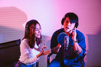 Singers singing at studio