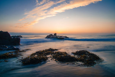 Scenic view of sea against sky during sunset