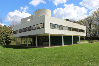 Built structure on field against sky