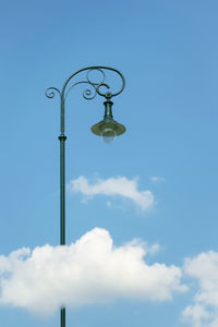 Low angle view of street light against sky