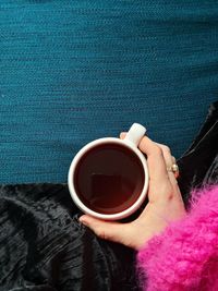 Close-up of woman holding coffee cup