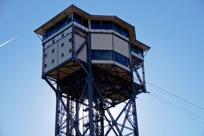 Low angle view of water tower against clear sky