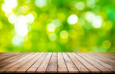 Defocused image of wooden bench in park