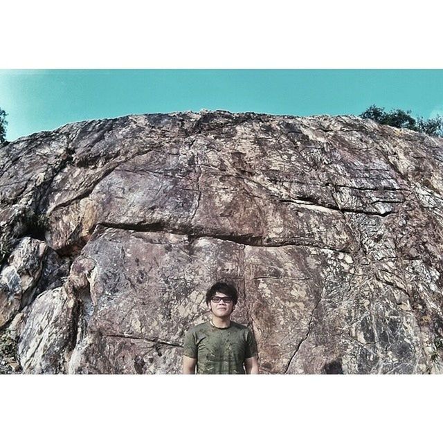 transfer print, auto post production filter, clear sky, low angle view, rock - object, rock formation, rock, blue, sky, nature, day, outdoors, mountain, standing, tranquility, sunlight, copy space, lifestyles