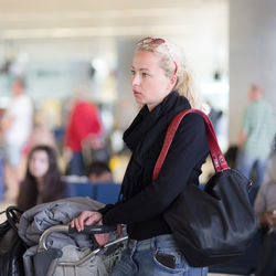 Woman looking at camera in city