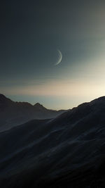 Scenic view of mountains against sky during sunset