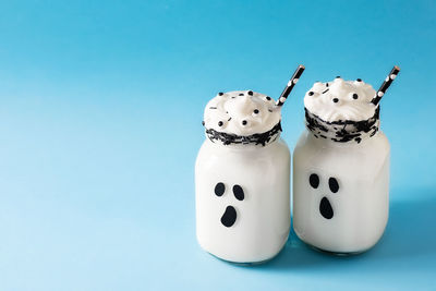 Close-up of candies against blue background