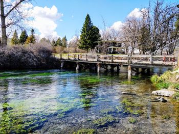 Bridge over lake against sky