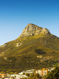 Scenic view of mountains against clear blue sky