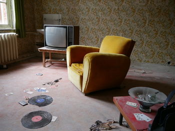 Empty couch with old television set in living room